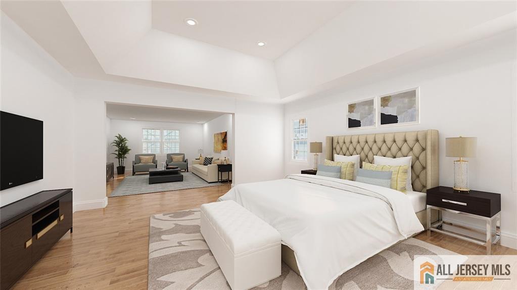 180 River Road Monroe Township, NJ 08831 - Photo 21 of 22 a spacious bedroom with a bed and a couch