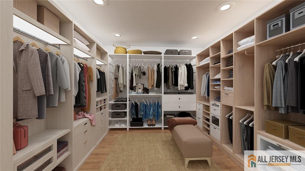 180 River Road Monroe Township, NJ 08831 - Photo 22 of 22 a view of walk in closet with clothes and shoes