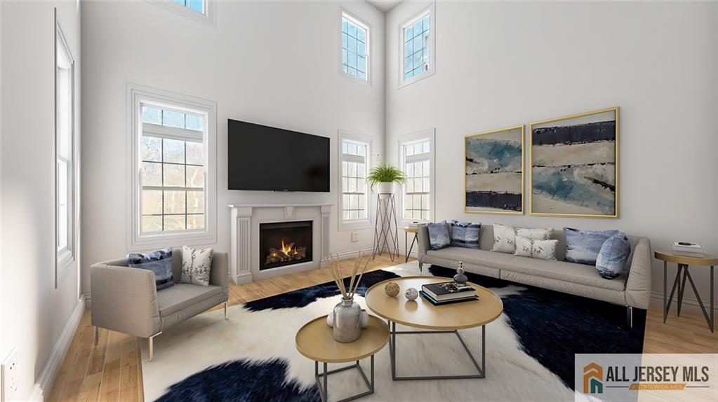 180 River Road Monroe Township, NJ 08831 - Photo 4 of 22 a living room with furniture a fireplace and a flat screen tv