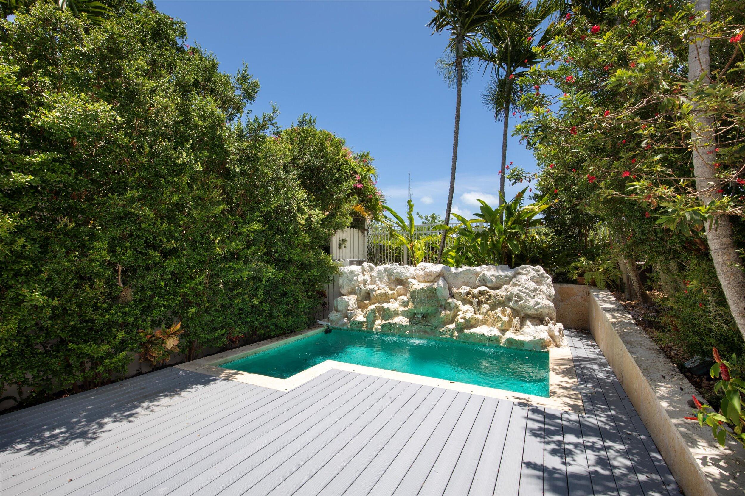 413 Emma Street, Unit A Key West, FL 33040 - Photo 15 of 64 a view of a backyard with plants