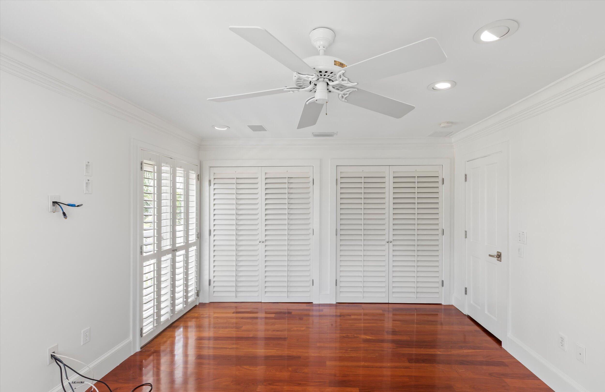 413 Emma Street, Unit A Key West, FL 33040 - Photo 33 of 64 a view of an empty room with wooden floor and a window