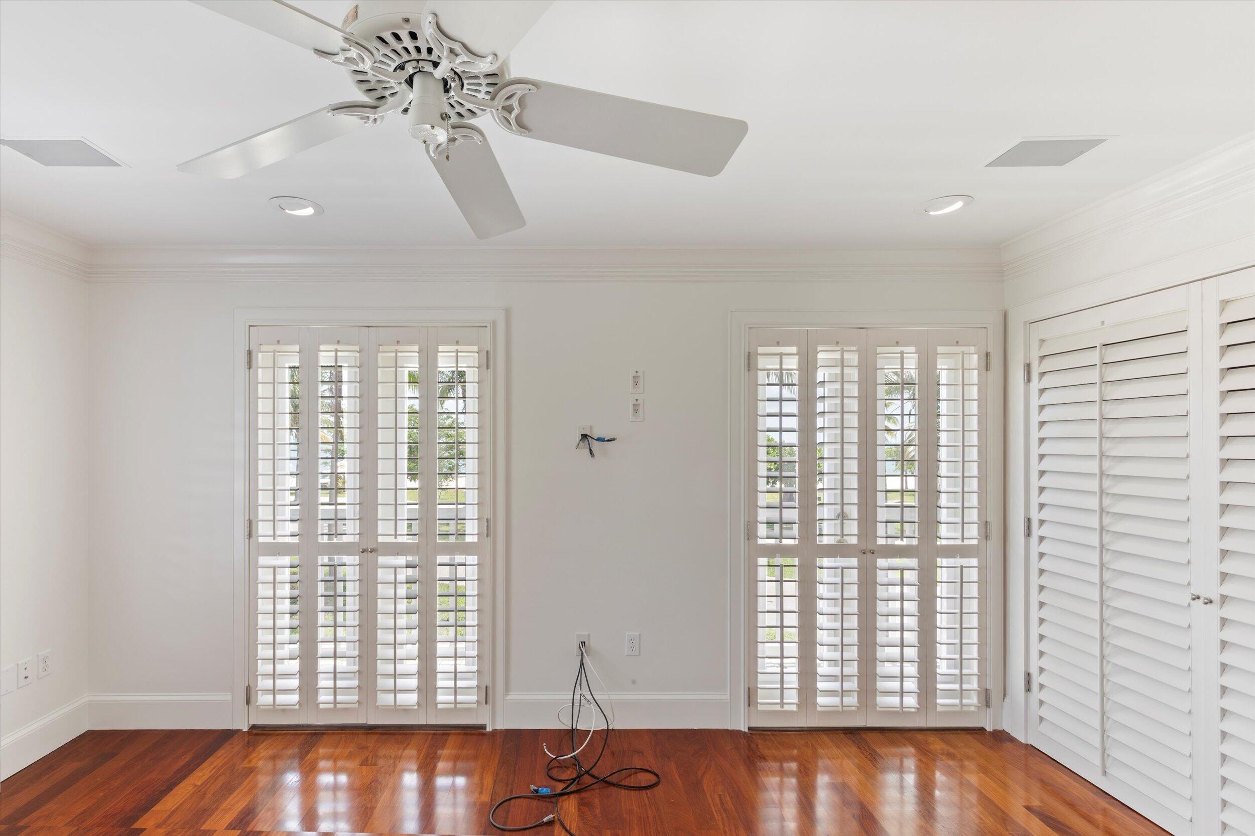 413 Emma Street, Unit A Key West, FL 33040 - Photo 35 of 64 a view of an empty room with wooden floor and a window
