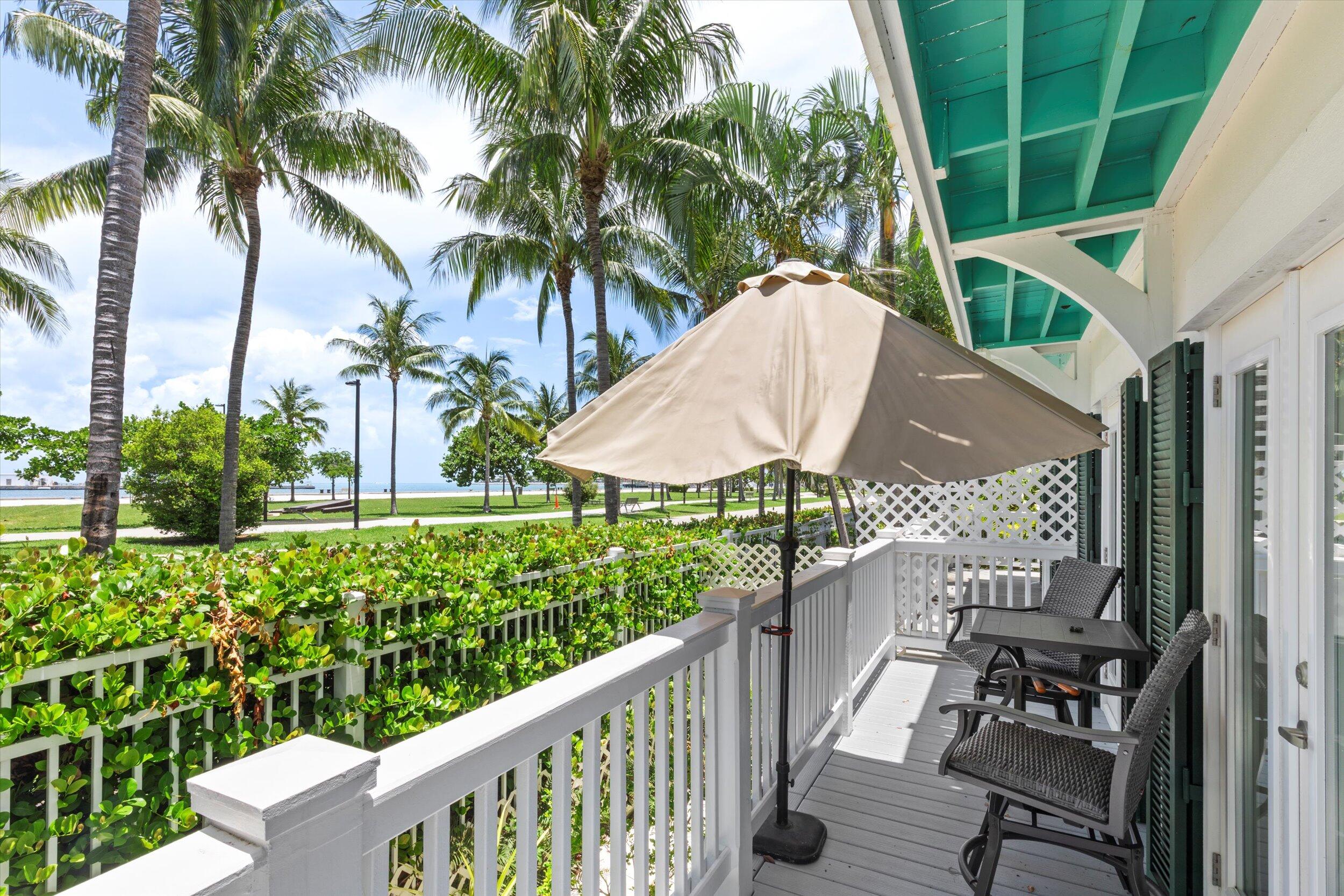 413 Emma Street, Unit A Key West, FL 33040 - Photo 4 of 64 a view of a balcony with chairs