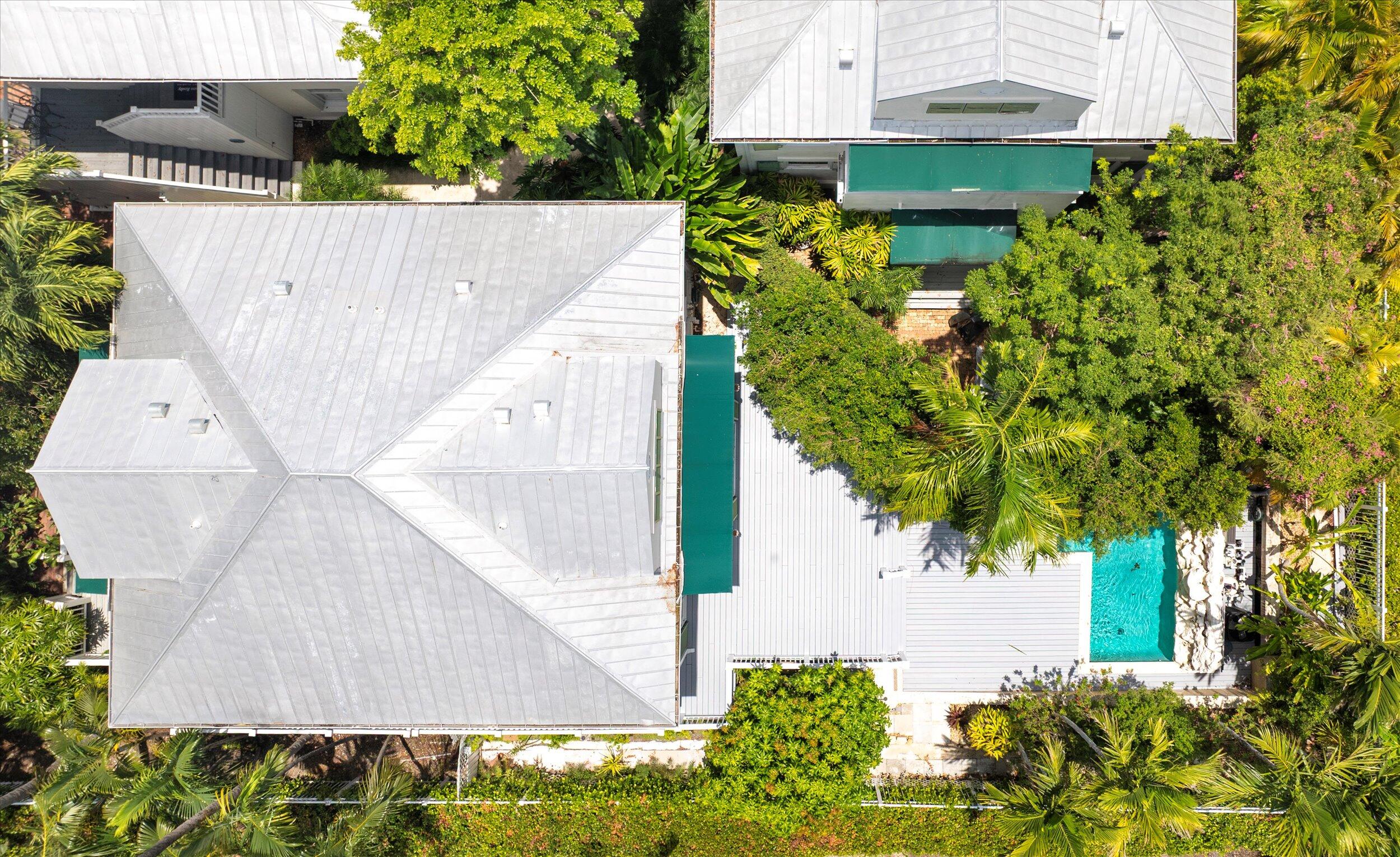 413 Emma Street, Unit A Key West, FL 33040 - Photo 54 of 64 an aerial view of a house with a yard and garden