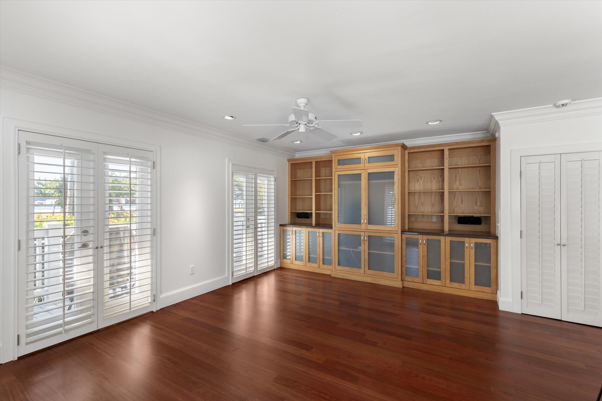 413 Emma Street, Unit A Key West, FL 33040 - Photo 6 of 64 wooden floor in an empty room with a window