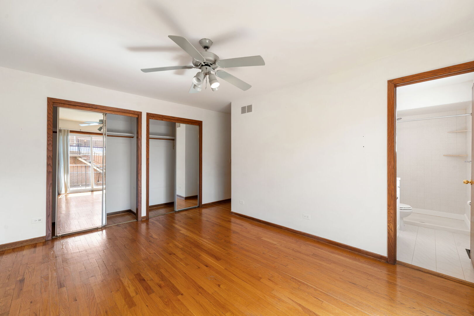 8427 West Windsor Avenue, Unit 1 Chicago, IL 60656 - Photo 13 of 34 an empty room with wooden floor closet and windows