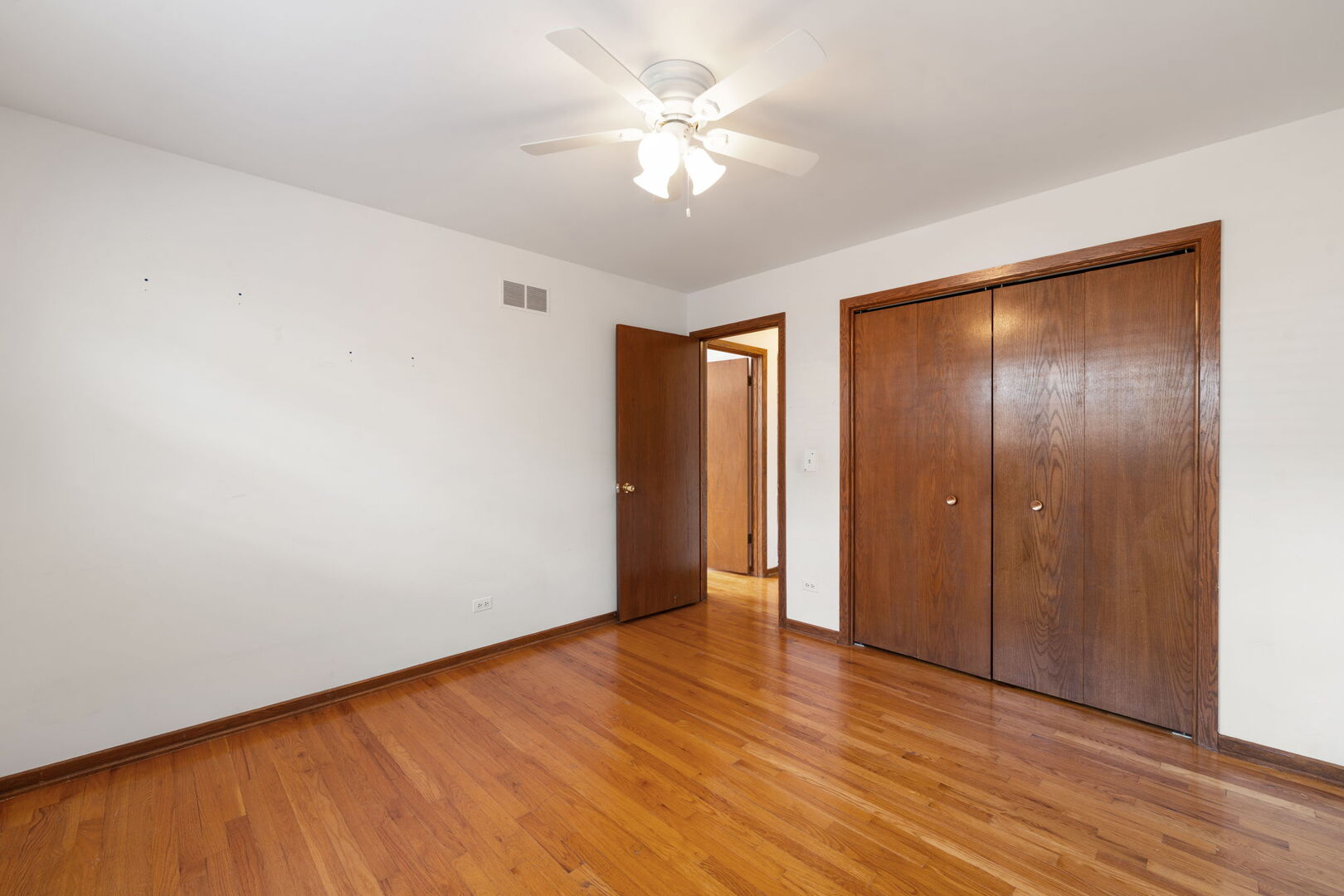 8427 West Windsor Avenue, Unit 1 Chicago, IL 60656 - Photo 20 of 34 a view of an empty room with wooden floor