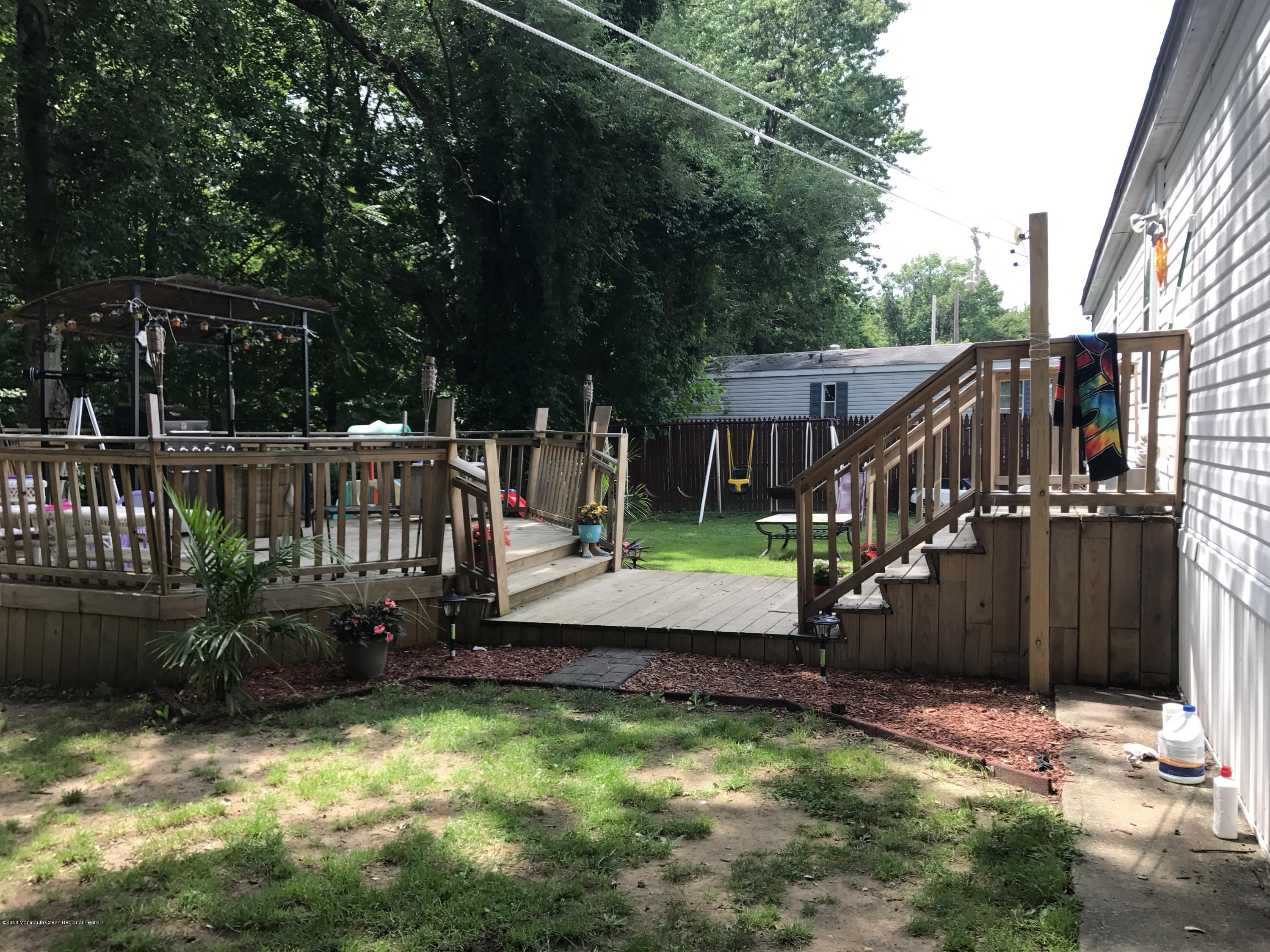 1272 Highway 36, Unit 39 Hazlet, NJ 07730 - Photo 13 of 13 a view of a house with backyard and sitting area