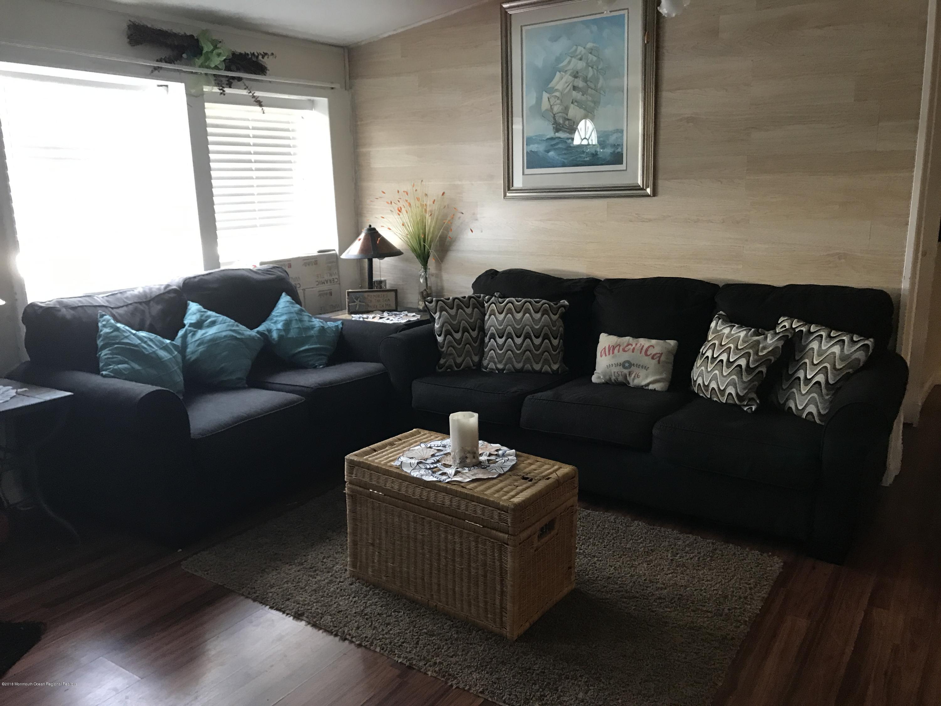 1272 Highway 36, Unit 39 Hazlet, NJ 07730 - Photo 3 of 13 a living room with furniture and a large window