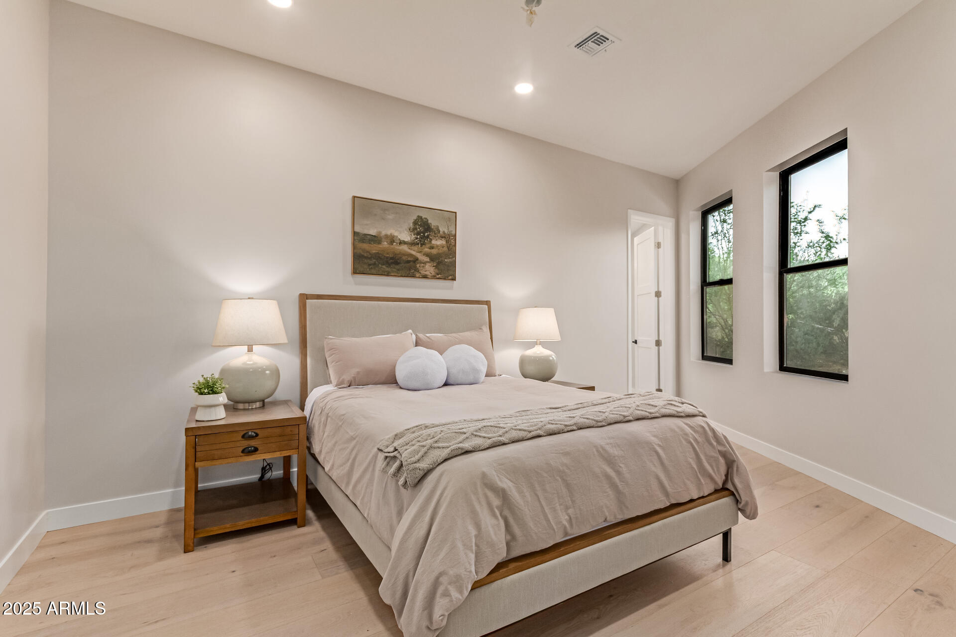 3301 East Rovey Avenue Paradise Valley, AZ 85253 - Photo 67 of 105 a bedroom with a bed and a night stand