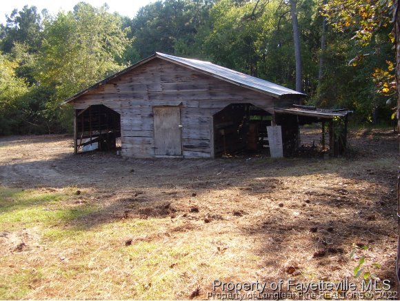 1348 Bainbridge Road Stedman, NC 28391 - Photo 3 of 4 a view of a house with a yard