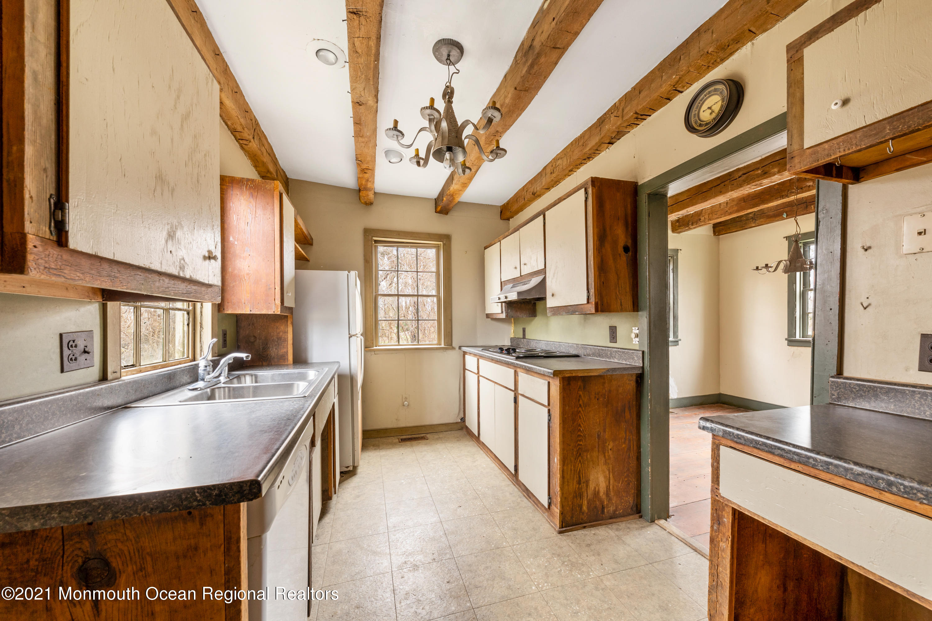 501 Province Line Road Allentown, NJ 08501 - Photo 11 of 24 a kitchen with stainless steel appliances granite countertop a sink a stove and a refrigerator