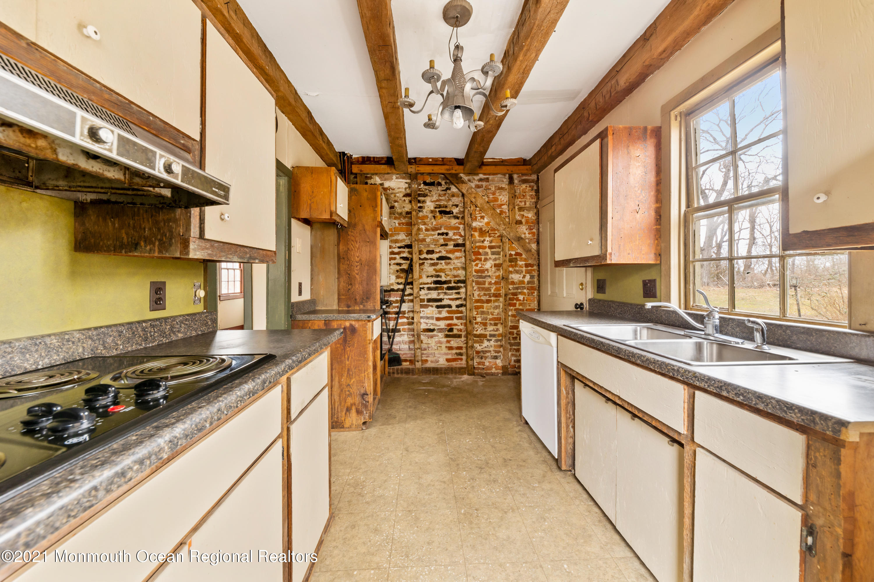 501 Province Line Road Allentown, NJ 08501 - Photo 12 of 24 a kitchen with a stove a sink and a refrigerator