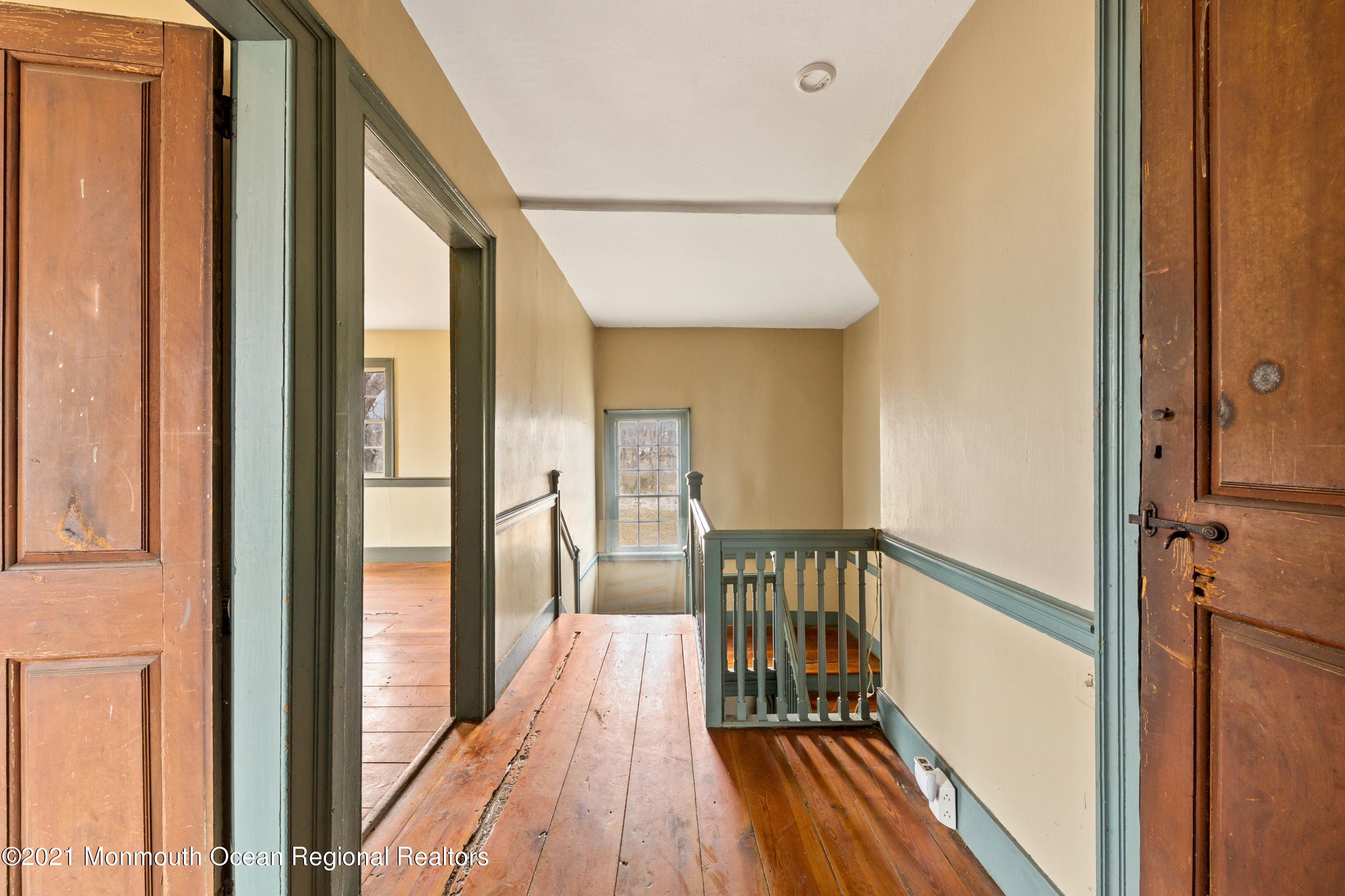 501 Province Line Road Allentown, NJ 08501 - Photo 13 of 24 a view of a hallway with wooden floor and staircase