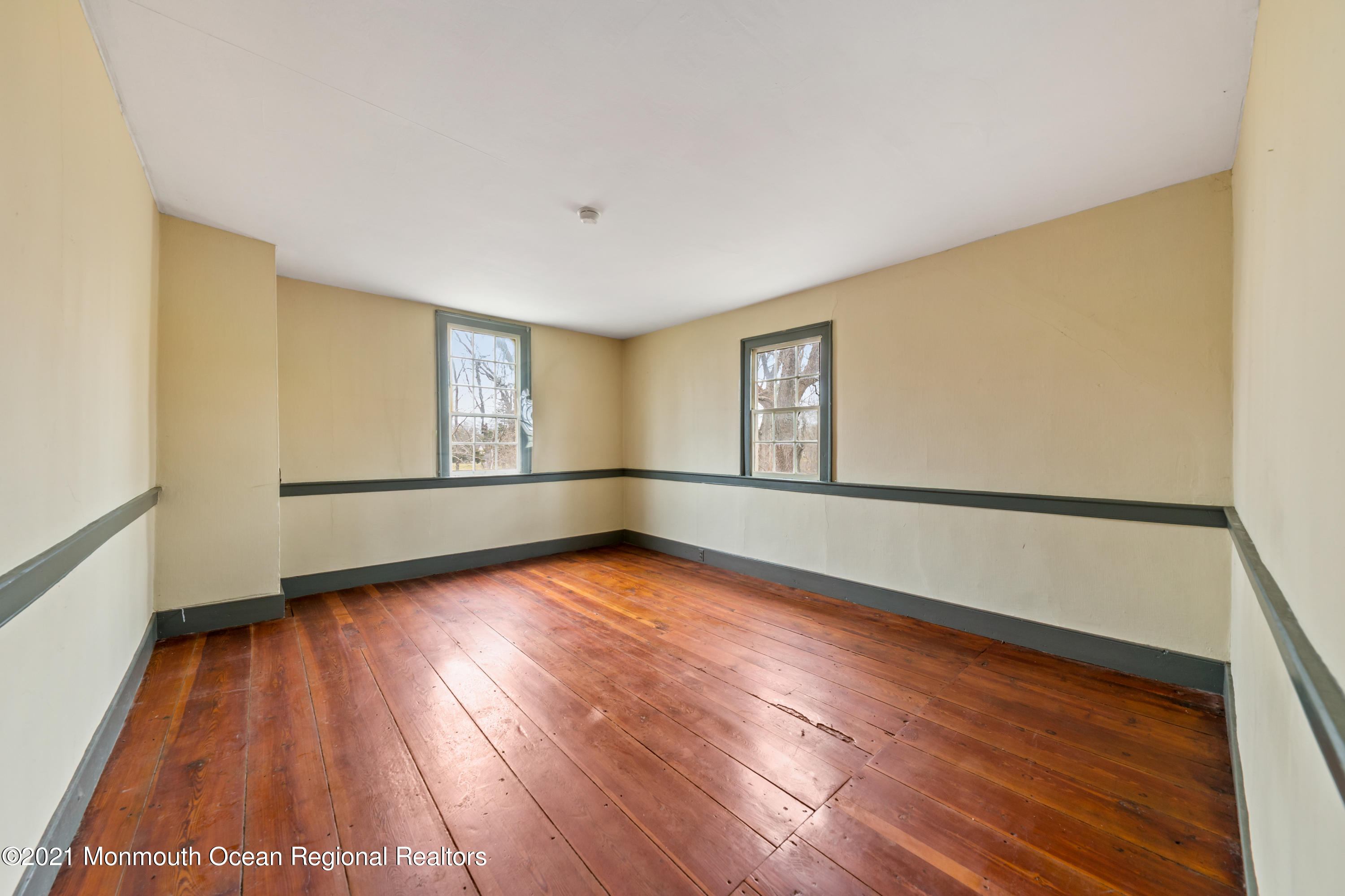 501 Province Line Road Allentown, NJ 08501 - Photo 14 of 24 a view of an empty room with wooden floor and a window