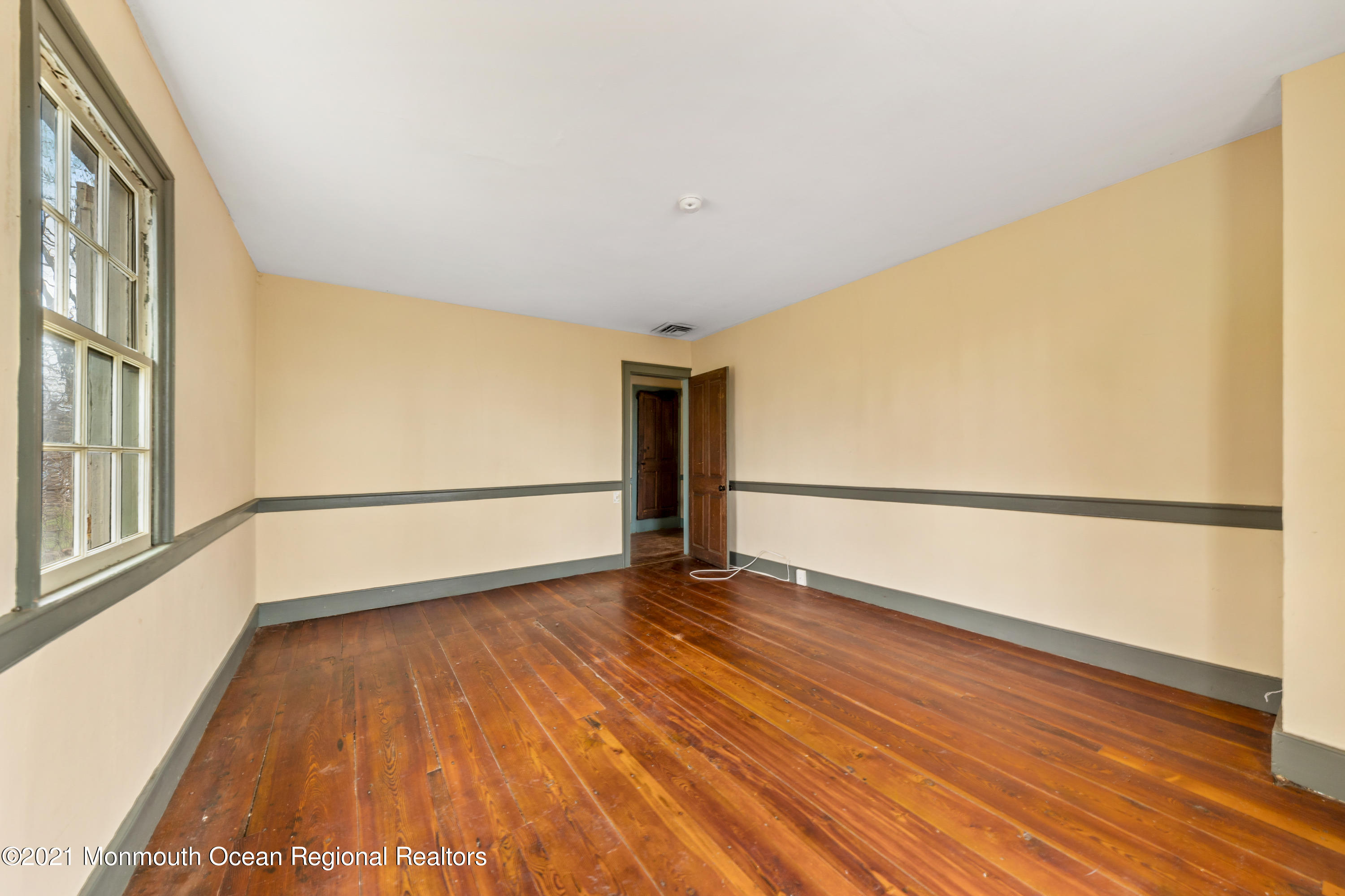 501 Province Line Road Allentown, NJ 08501 - Photo 15 of 24 a view of an empty room with wooden floor