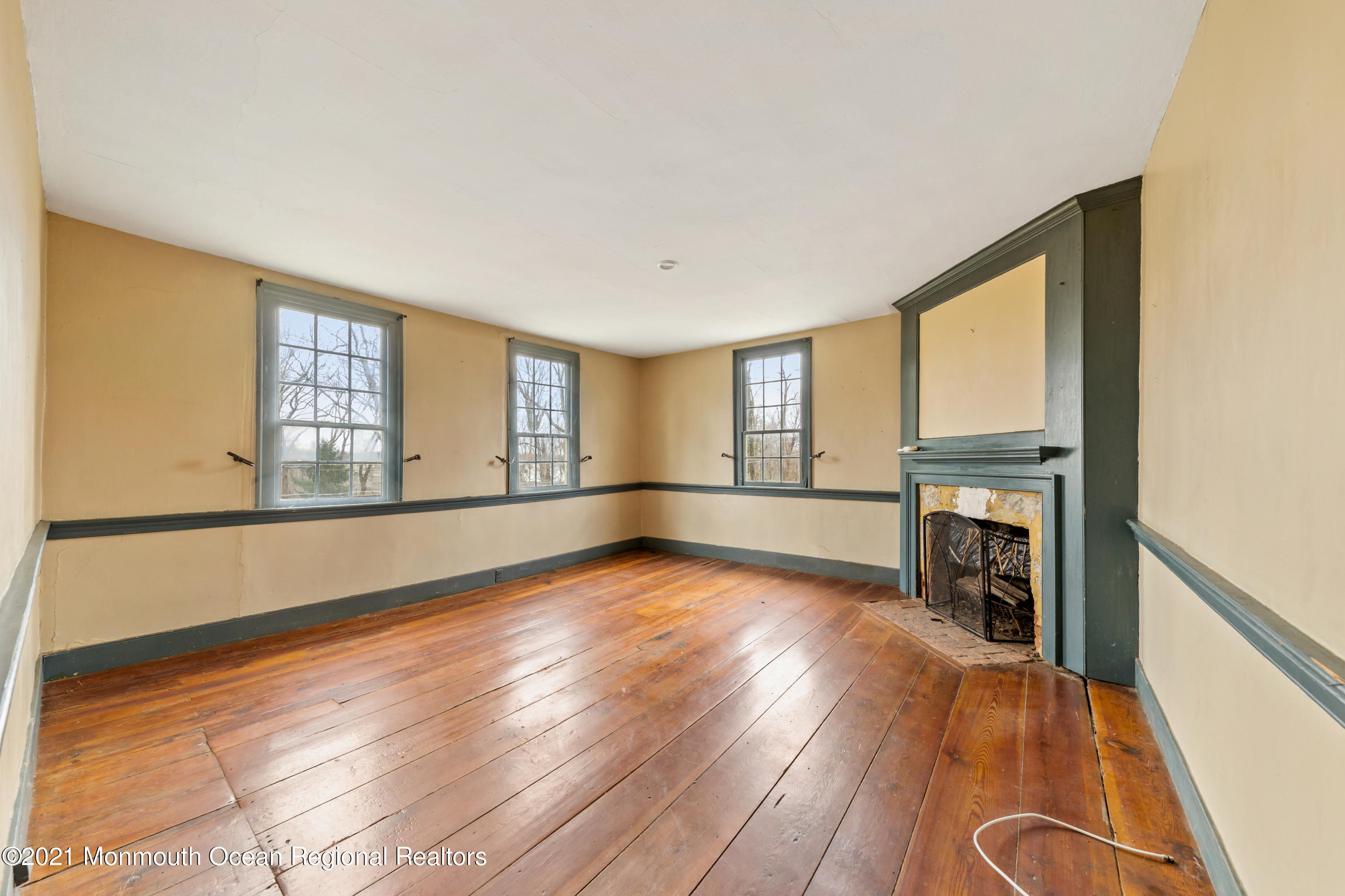 501 Province Line Road Allentown, NJ 08501 - Photo 16 of 24 a view of an empty room with a window and wooden floor