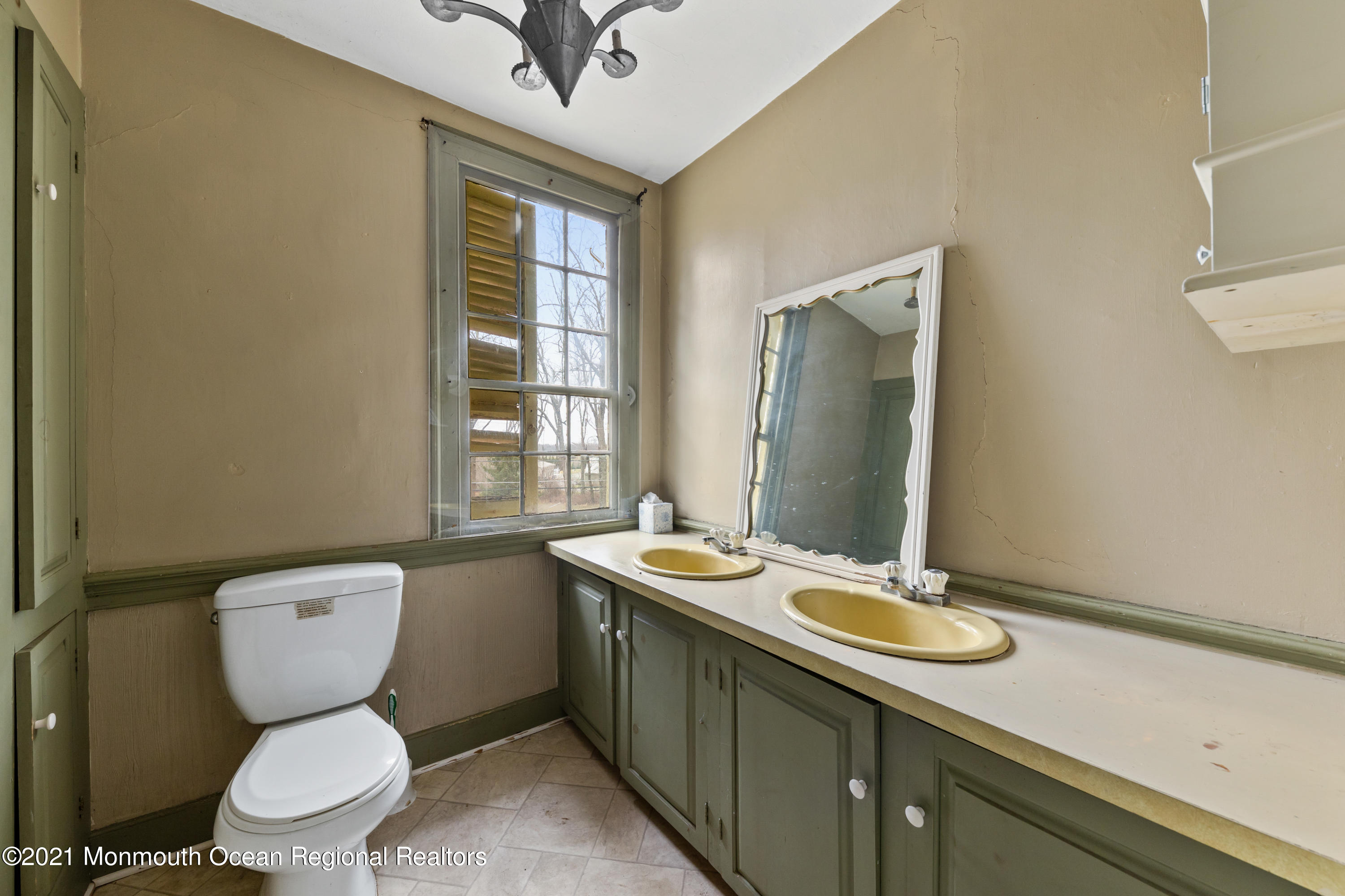 501 Province Line Road Allentown, NJ 08501 - Photo 17 of 24 a bathroom with a granite countertop toilet sink and mirror