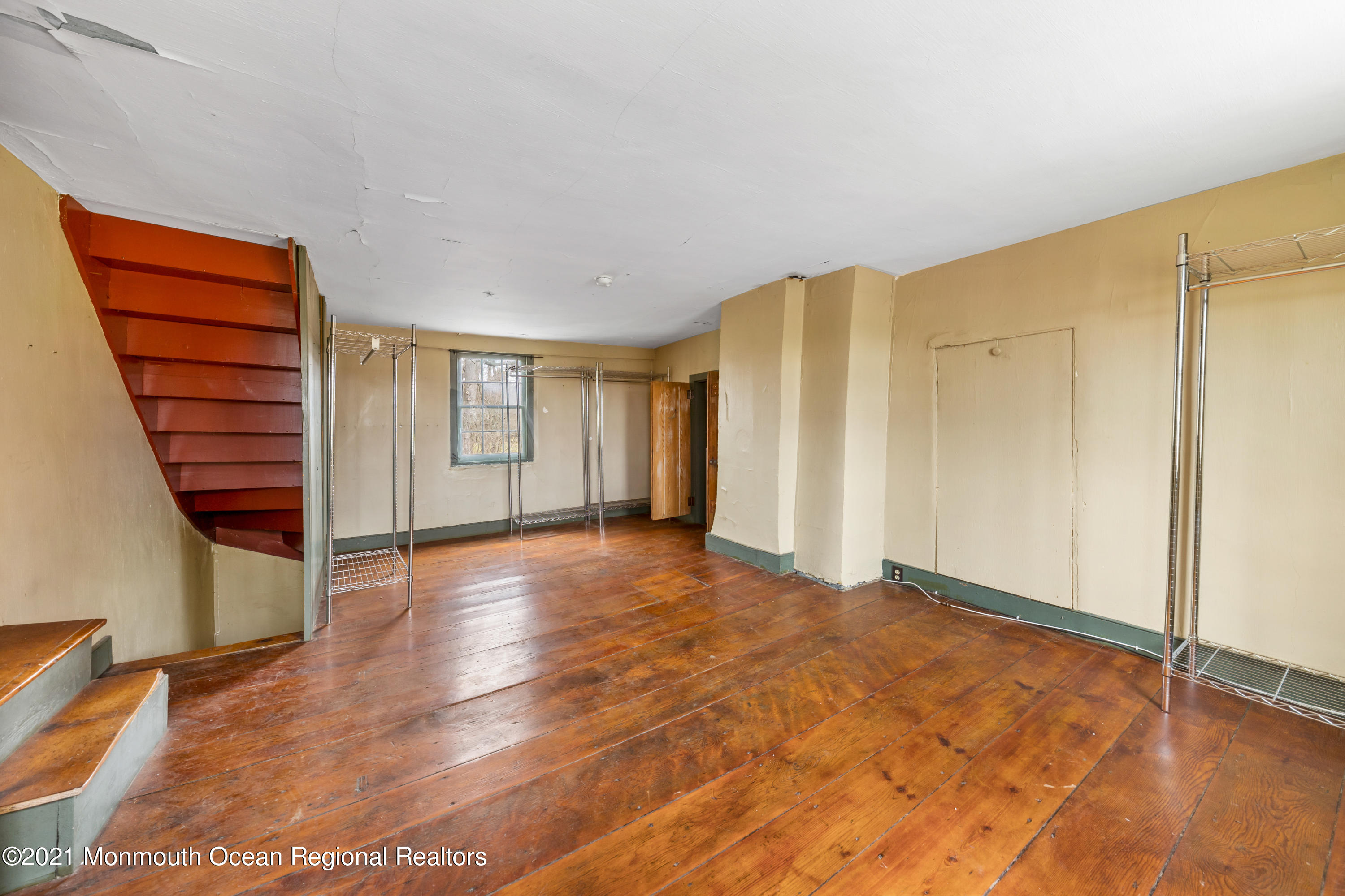 501 Province Line Road Allentown, NJ 08501 - Photo 18 of 24 a view of an empty room with window and wooden floor