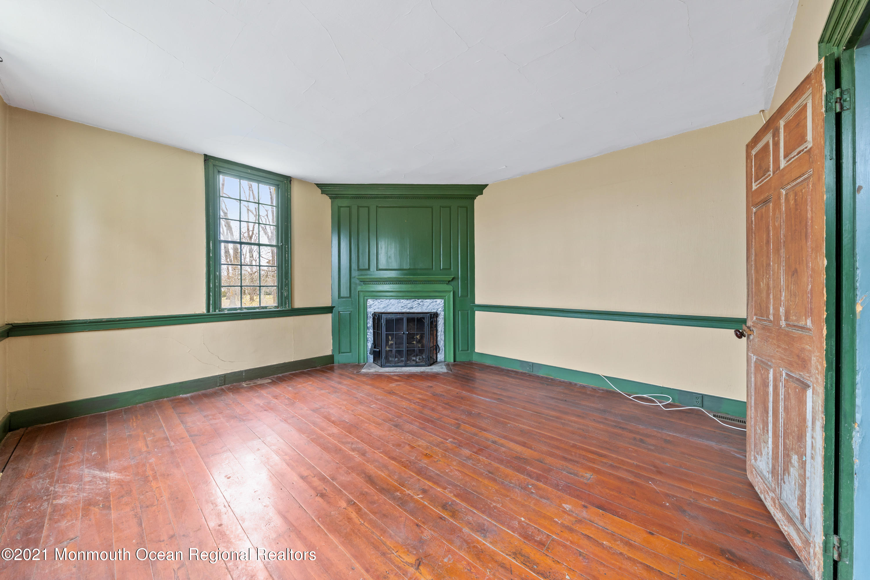501 Province Line Road Allentown, NJ 08501 - Photo 4 of 24 a view of an empty room with a window and wooden floor