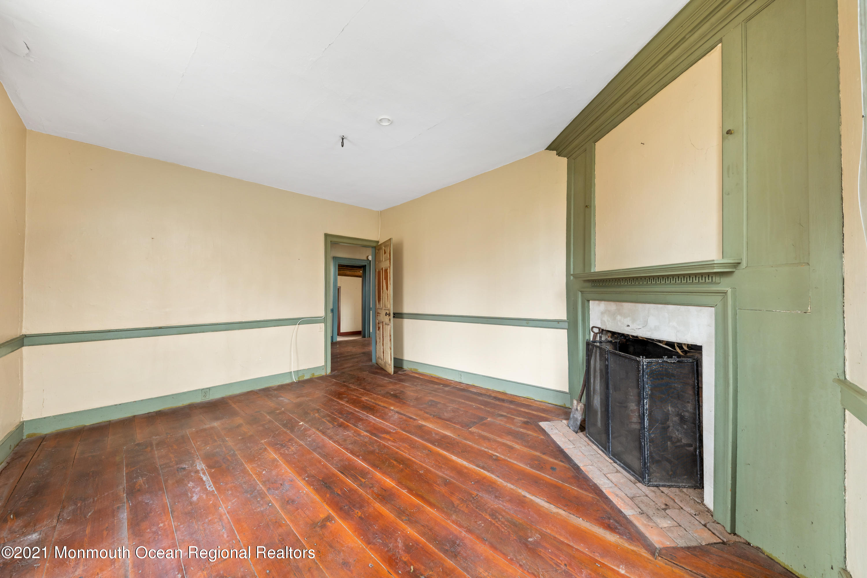 501 Province Line Road Allentown, NJ 08501 - Photo 7 of 24 a view of an empty room with wooden floor and a window