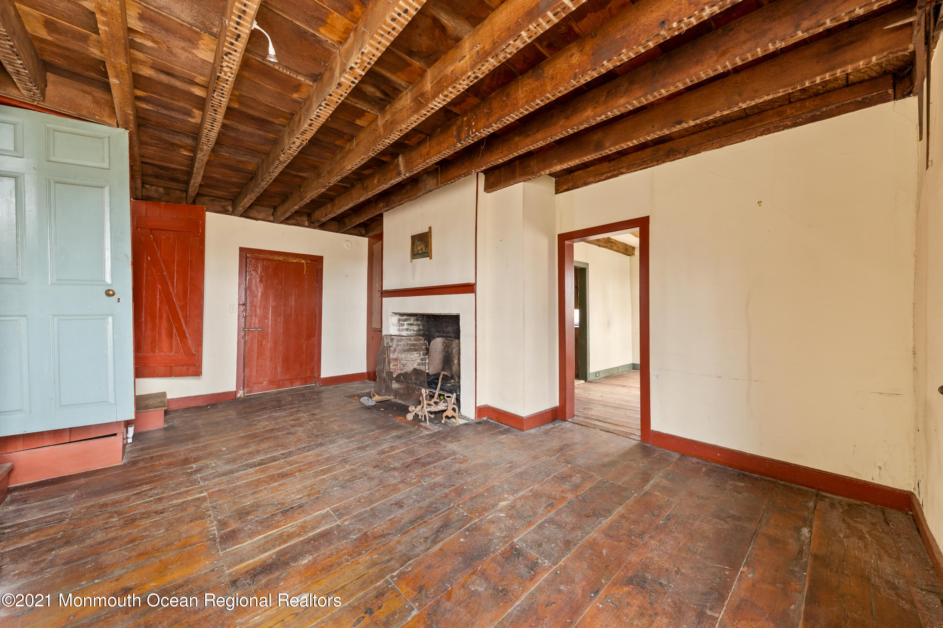 501 Province Line Road Allentown, NJ 08501 - Photo 8 of 24 a view of empty room with wooden floor and fireplace