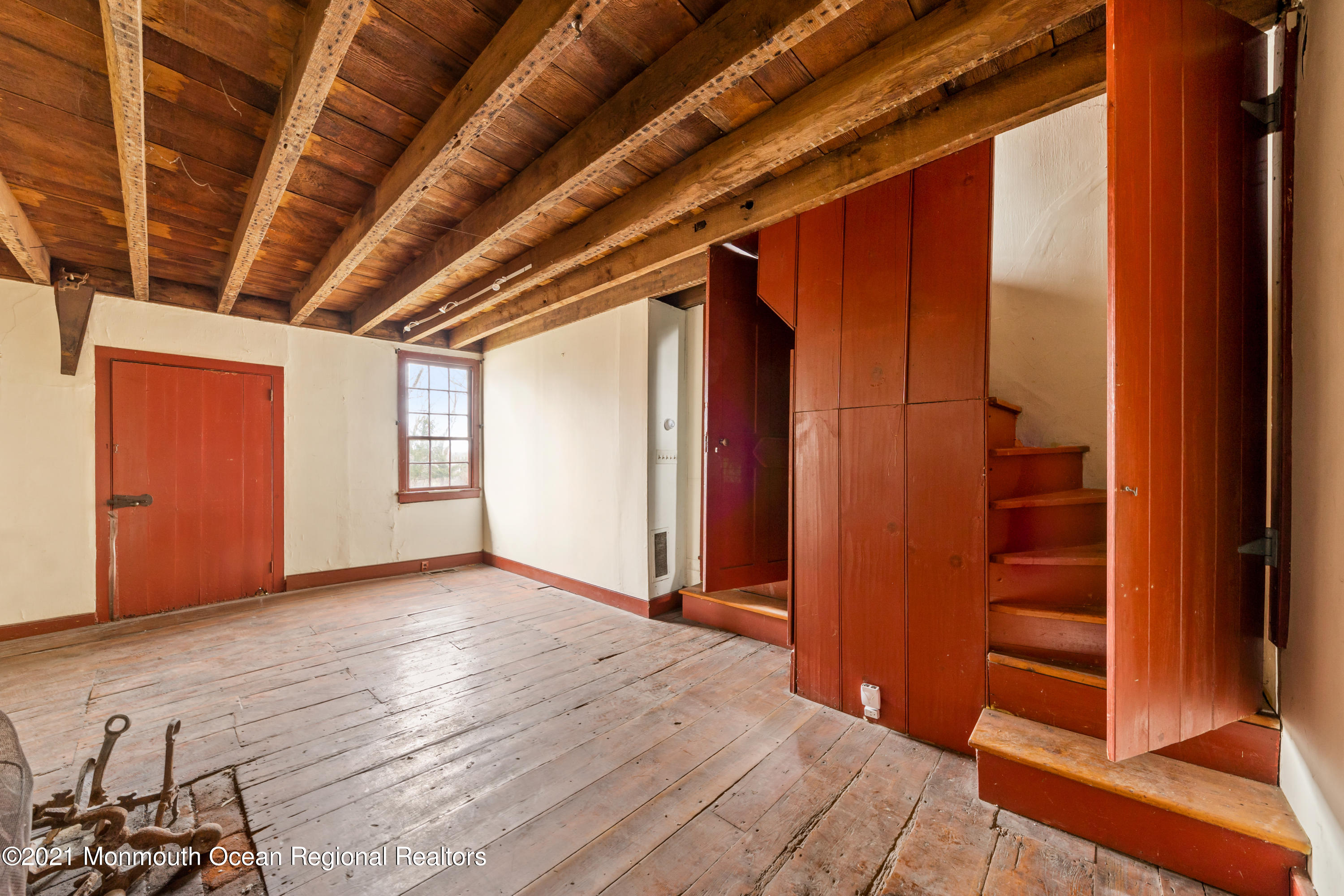 501 Province Line Road Allentown, NJ 08501 - Photo 9 of 24 a view of an empty room with wooden floor and windows