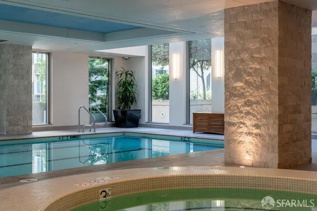 a view of a patio with couches table and chairs with potted plants