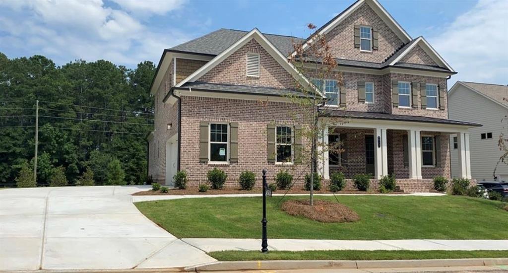 a front view of a house with a yard