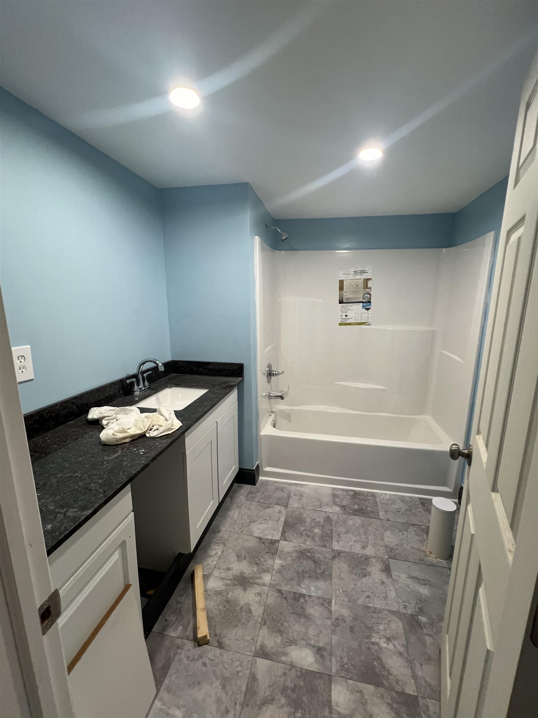 142 Jesse Road St. Augustine, FL 32092 - Photo 23 of 28 a bathroom with a granite countertop sink a toilet and bathtub