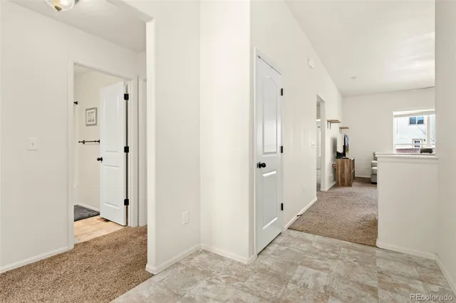 a view of a hallway with two rooms