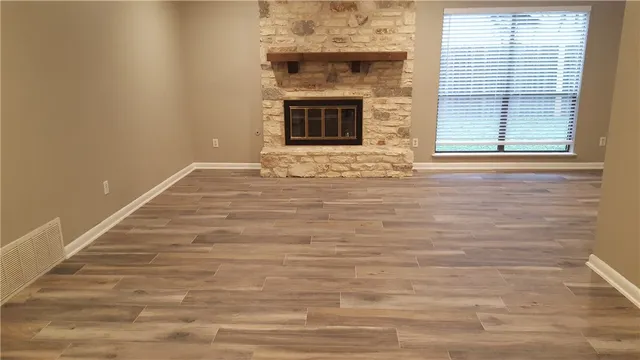 a view of a fireplace with wooden floor