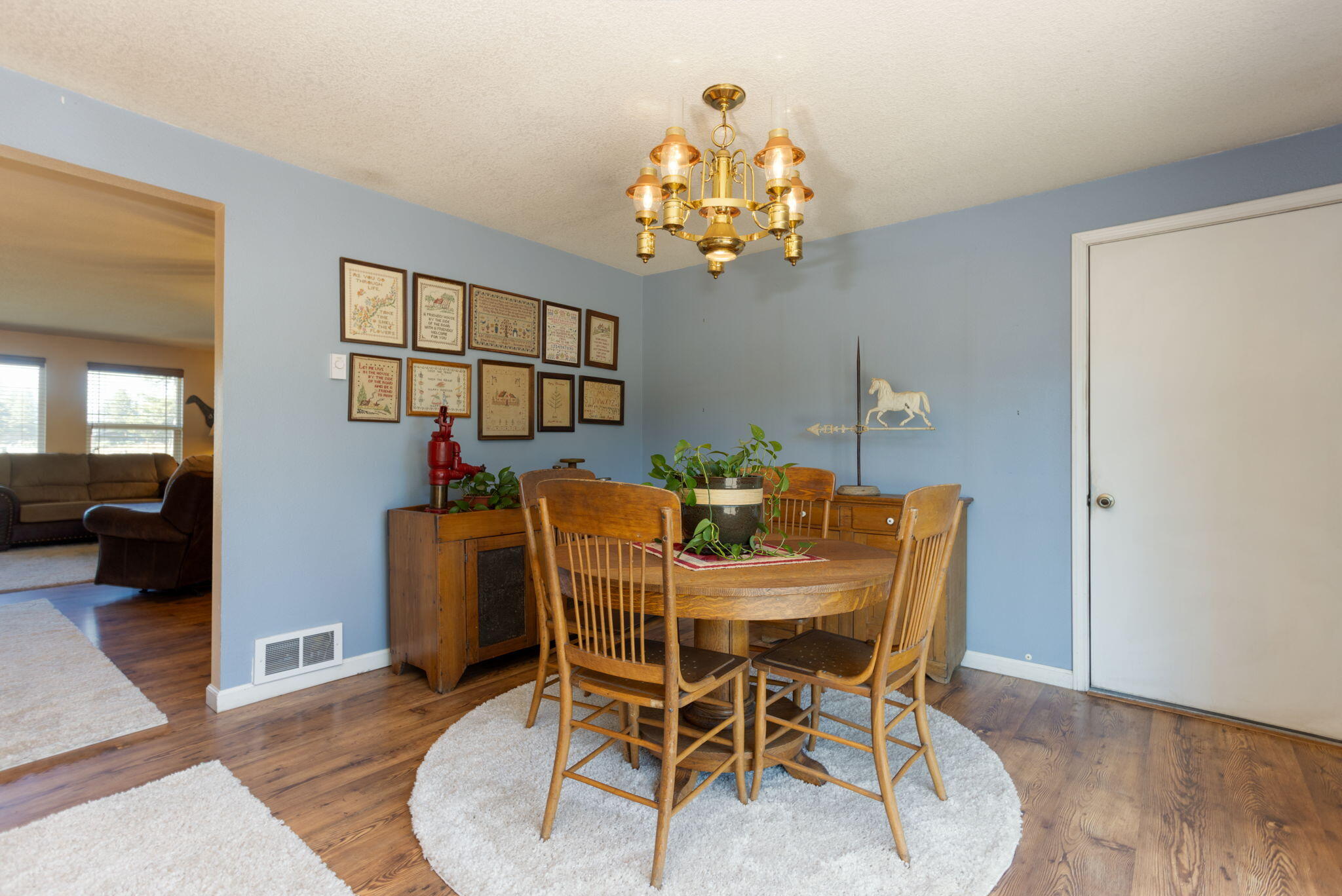 19450 Calico Road Bend, OR 97702 - Photo 14 of 41 a view of a dining room with furniture and chandelier