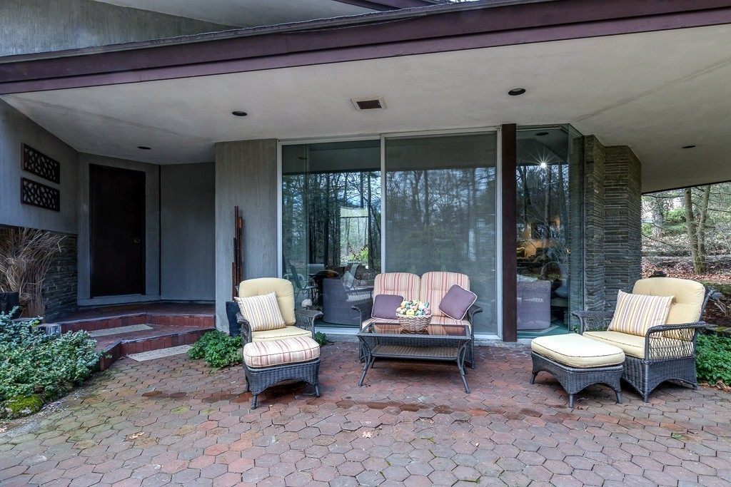 64 Oak Hill Road Worcester, MA 01609 - Photo 22 of 23 a outdoor living space with patio furniture and a potted plant