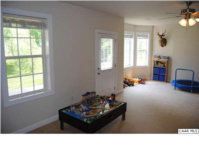 1370 Amber Ridge Road Charlottesville, VA 22901 - Photo 26 of 29 a living room with furniture and a window