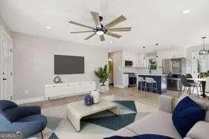 a living room with furniture and a flat screen tv