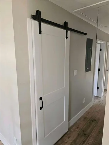 a bathroom with a shower and a mirror