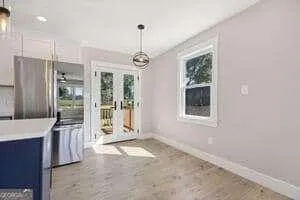 a view of a room with a chandelier and living room