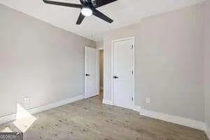 a view of a room with a ceiling fan
