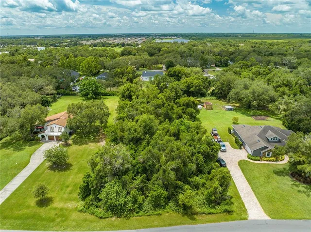 a view of a yard with an outdoor seating