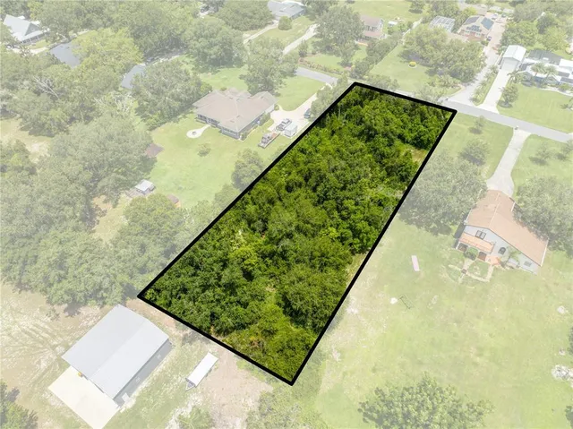 a view of a yard with an outdoor space