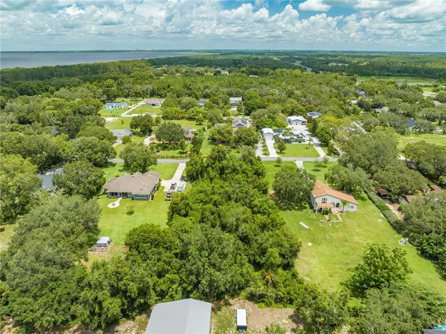 a view of a lake with a yard