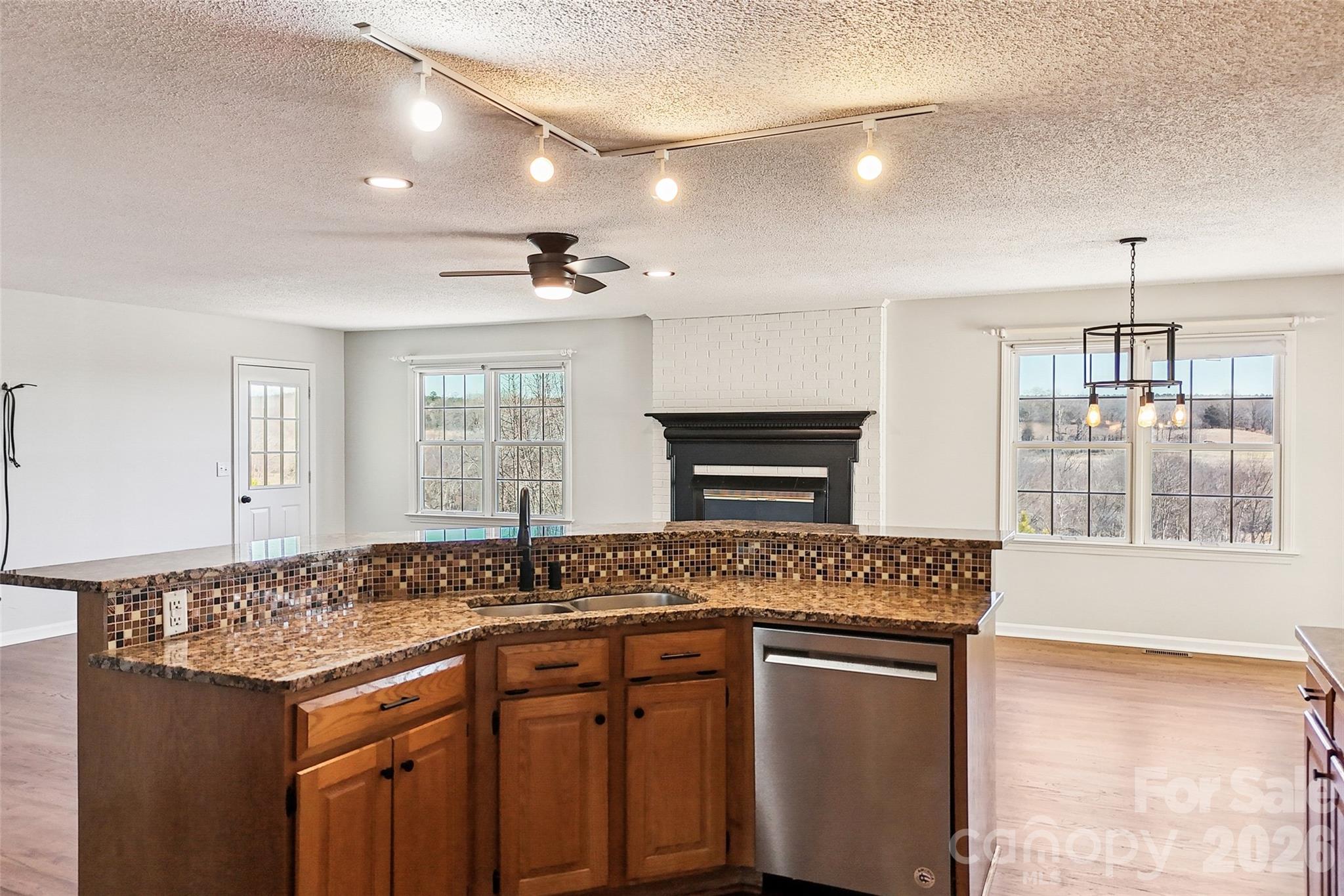 2034 New Prospect Church Road Shelby, NC 28150 - Photo 11 of 48 a kitchen with granite countertop a sink and stove