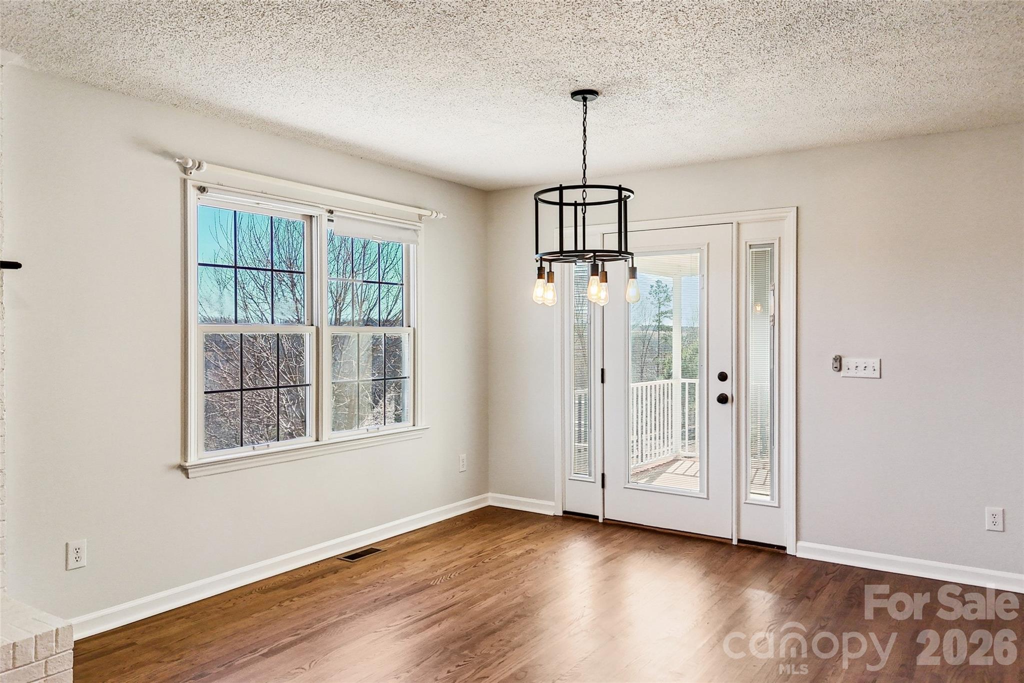 2034 New Prospect Church Road Shelby, NC 28150 - Photo 13 of 48 a view of empty room with wooden floor and fan