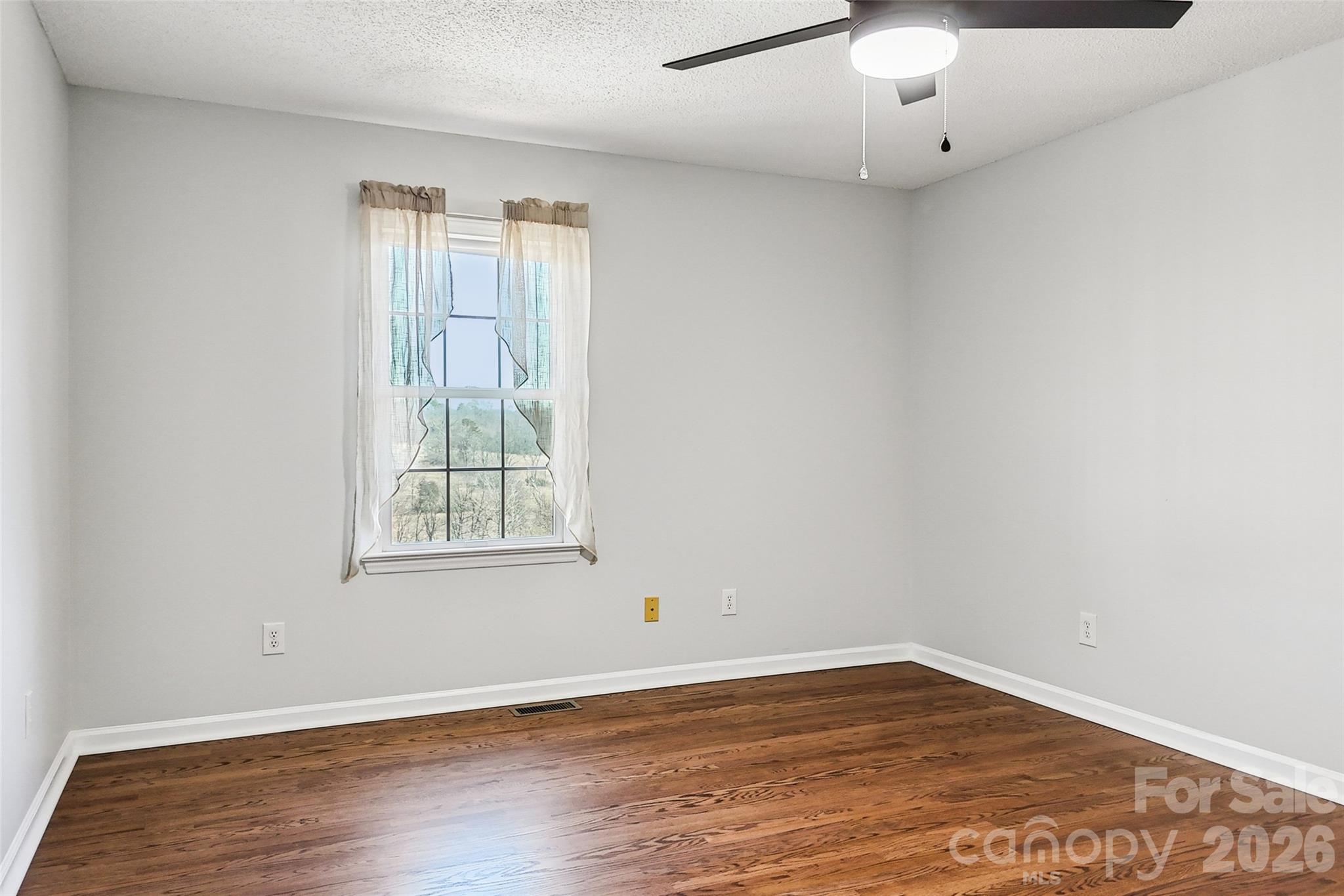 2034 New Prospect Church Road Shelby, NC 28150 - Photo 25 of 48 an empty room with wooden floor and windows