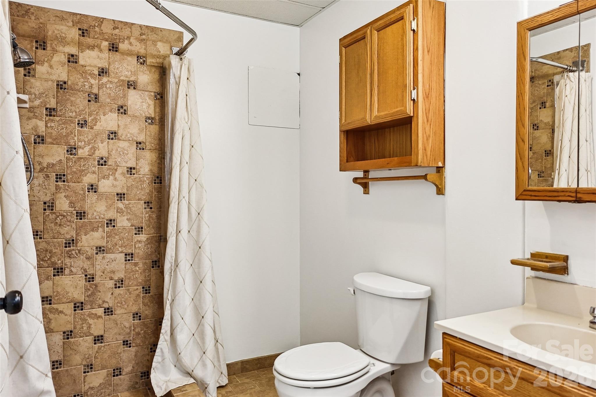 2034 New Prospect Church Road Shelby, NC 28150 - Photo 36 of 48 a white toilet sitting next to a bathroom sink