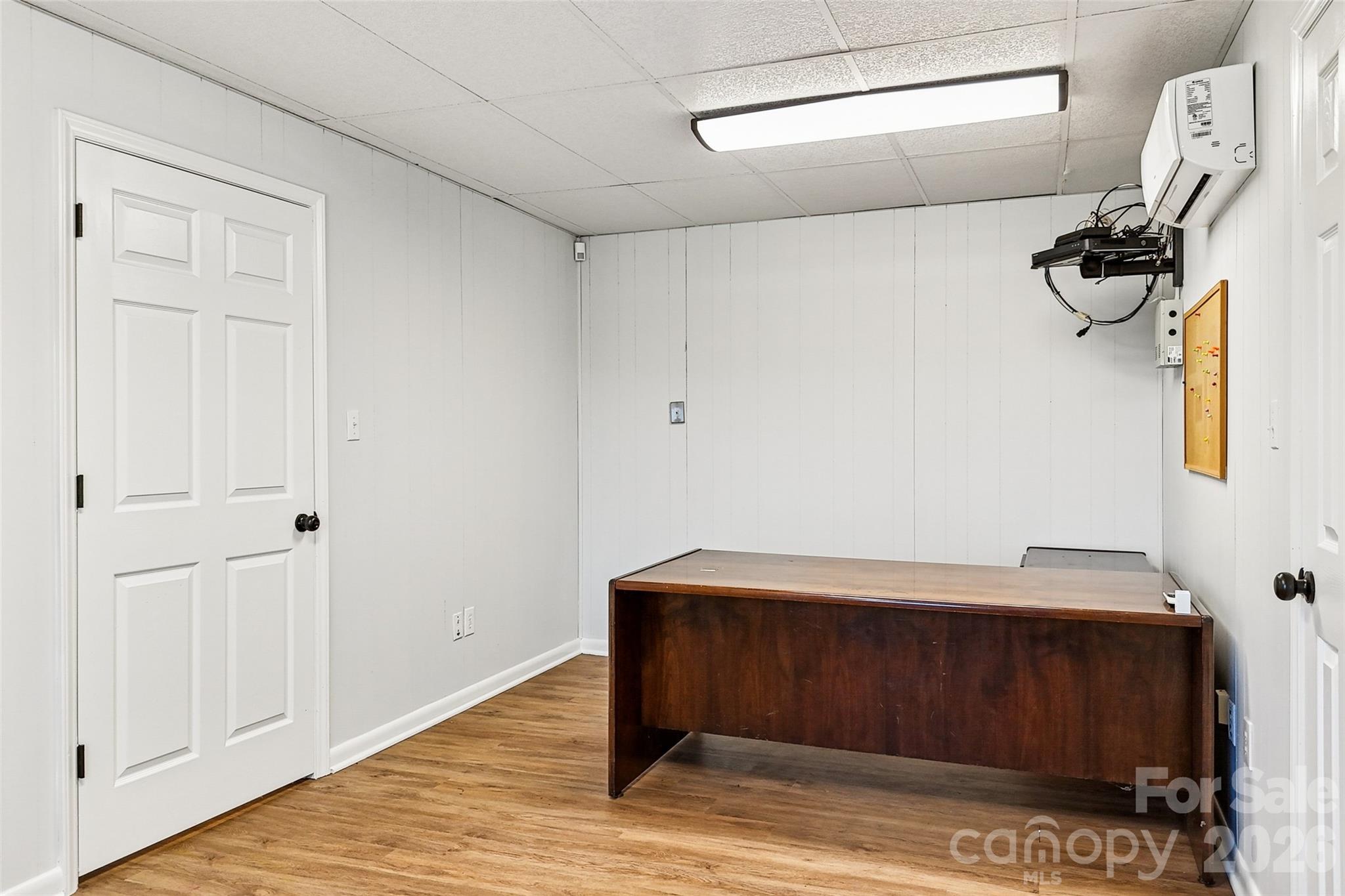 2034 New Prospect Church Road Shelby, NC 28150 - Photo 38 of 48 a room with a mirror and a wooden floor