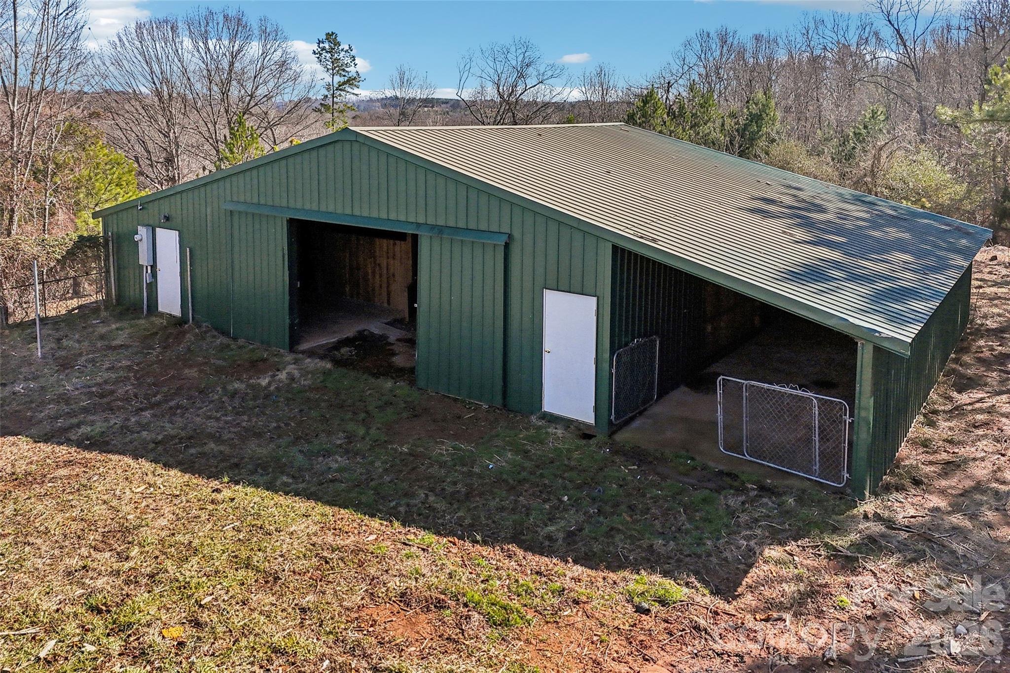 2034 New Prospect Church Road Shelby, NC 28150 - Photo 45 of 48 a backyard of a house with a yard and garage