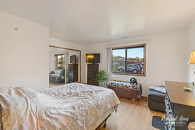 a bathroom with a sink mirror and a toilet