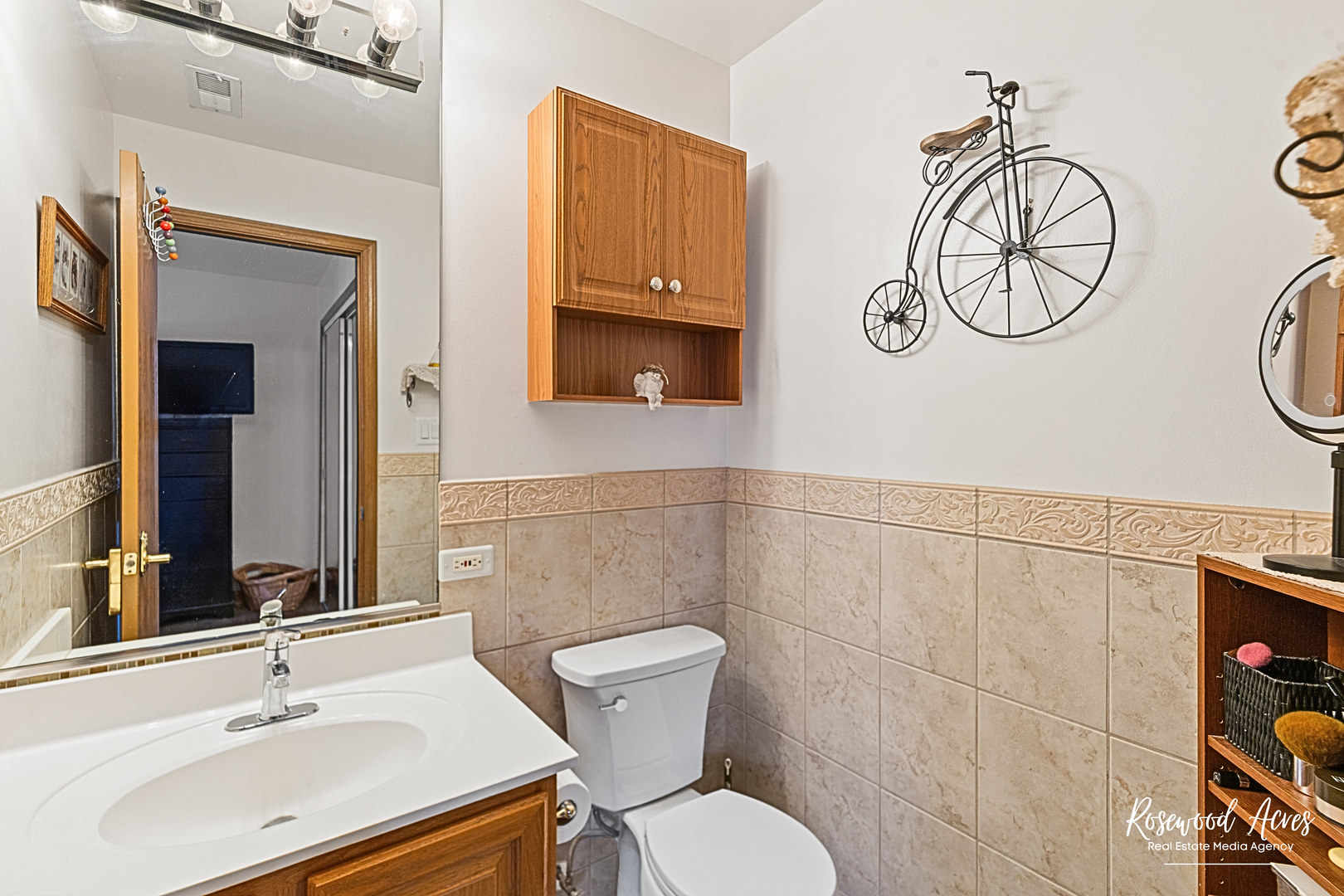 15718 Peggy Lane, Unit 2 Oak Forest, IL 60452 - Photo 12 of 16 a bathroom with a sink mirror and a toilet
